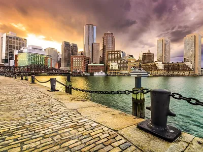 BOSTON, USA - JUNE 9, 2013: People visit South Boston with Boston skyline  view. Boston is the largest city in Massachusetts with estimated 2014  popula Stock Photo - Alamy