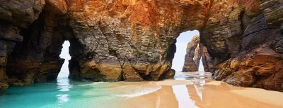 Natural rock arches on Cathedrals beach in Galicia, Northern Spain.  Cantabric coast, Galicia, Spain Stock Photo - Alamy