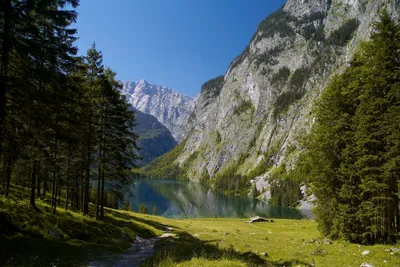 Фото Альпы Германия Eibsee Горы Природа Озеро Пейзаж Камни 1920x1080