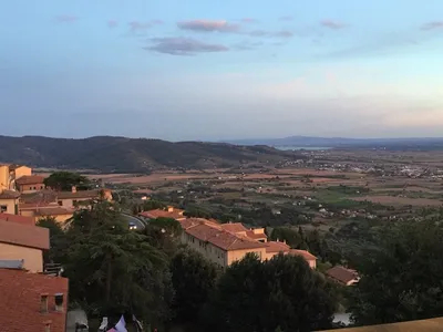 A beautiful view of Tuscany from the village of Cortona Italy with a cat on  a wall Stock Photo - Alamy