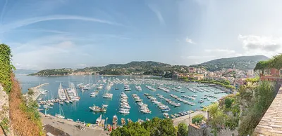 19.08. 2019 - Lerici. Liguria. Italy. Beach with many umbrellas and very  busy in the summer on the Ligurian coast. 16782513 Stock Photo at Vecteezy
