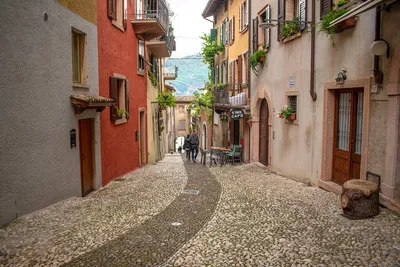 Charming old narrown streets of Italian villages. Malcesine, Garda lake,  Italy. Autumn colors, cosy street bars Stock Photo | Adobe Stock
