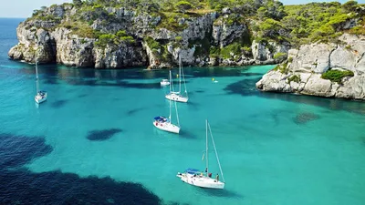 Cala Mitjaneta И Cala Mitjana В Солнечный Летний День, Менорка, Испания.  Фотография, картинки, изображения и сток-фотография без роялти. Image  66132139