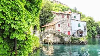 Town of Nesso on steep cliffs and creek waterfall on Como Lake a Photograph  by Brch Photography - Pixels