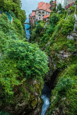 Nesso, Italy - April 29, 2017: Nesso, lake Como, Como province, Italy. Lake  shore from the roman stone bridge stock photo - OFFSET