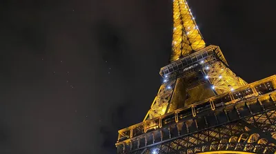 Illuminated Christmas tree in the old town in Paris, with christmas stalls  and Eiffel Tower, in the evening Stock Illustration | Adobe Stock