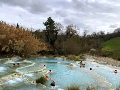 The Ultimate Guide to Saturnia Hot Springs - backpacks and bubbly