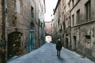 Old medieval streets of Siena, Tuscany, Italy. Siena architecture and  landmark. Picturesque streets of Siena, Italy.Travel destination of Italy  and Siena. Stock Photo | Adobe Stock