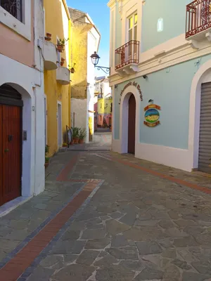 Narrow Historic Medieval Streets of a Small Town in Southern Italy. Old  Stone Houses, Wooden Windows and Doors, Cobblestone Road Stock Photo -  Image of city, architecture: 249505982