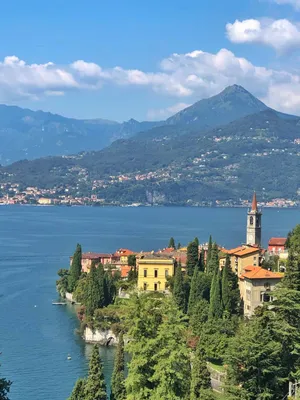 Narrow street in Varenna town at lake Como in Italy Stock Photo - Alamy