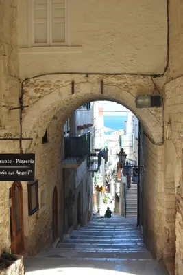 Vieste in Italy, an old Town on sea cliff and beaches: ancient houses and  church Stock Photo - Alamy