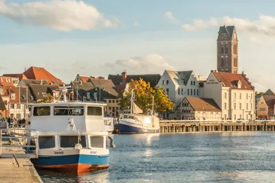 Premium Photo | Old historic buildings by frische grube wismar germany in  autumn